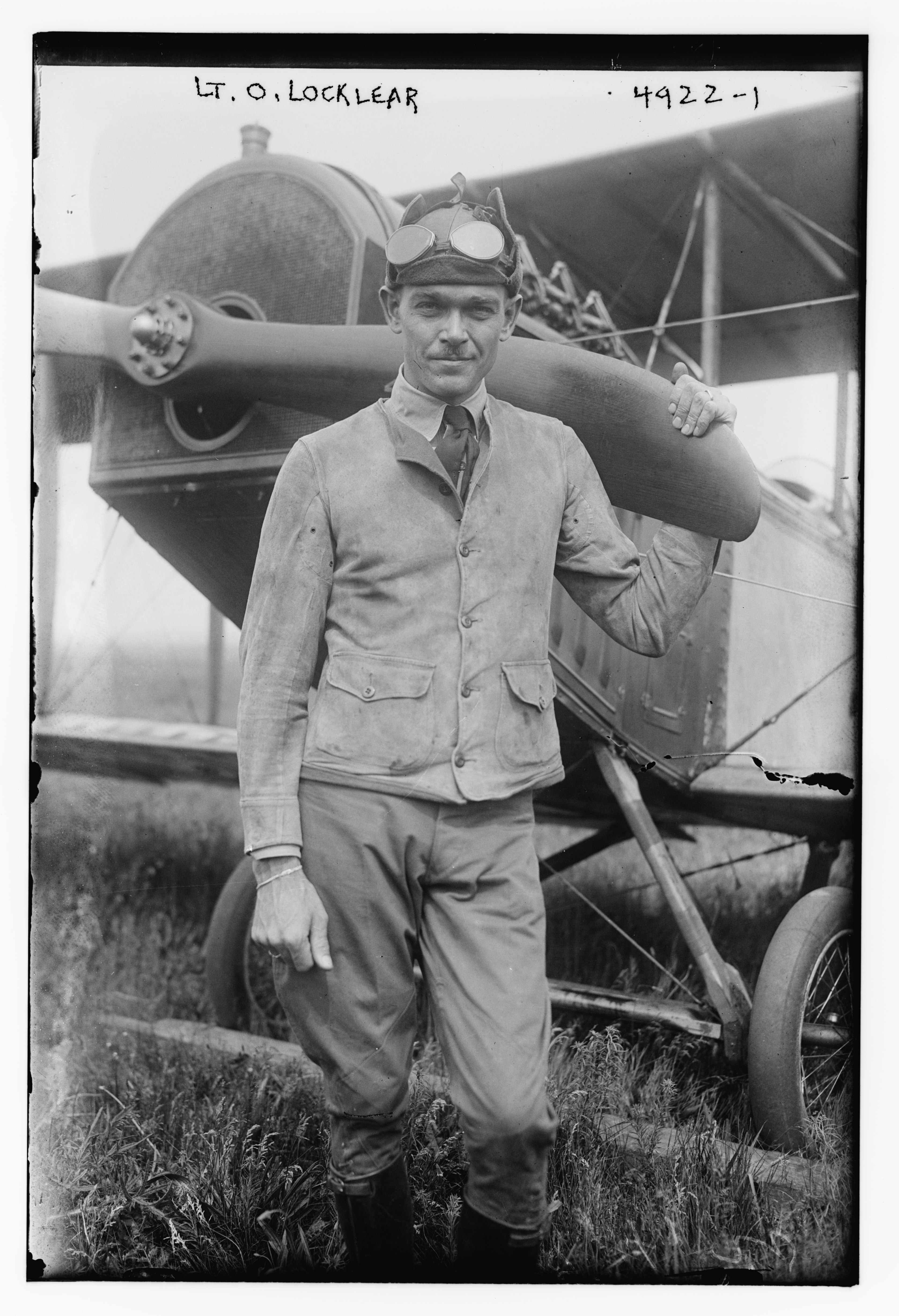 Stunt pilot and actor Ormer Locklear wears a leather flying cap and goggles in a 1915 Bain News Service portrait.