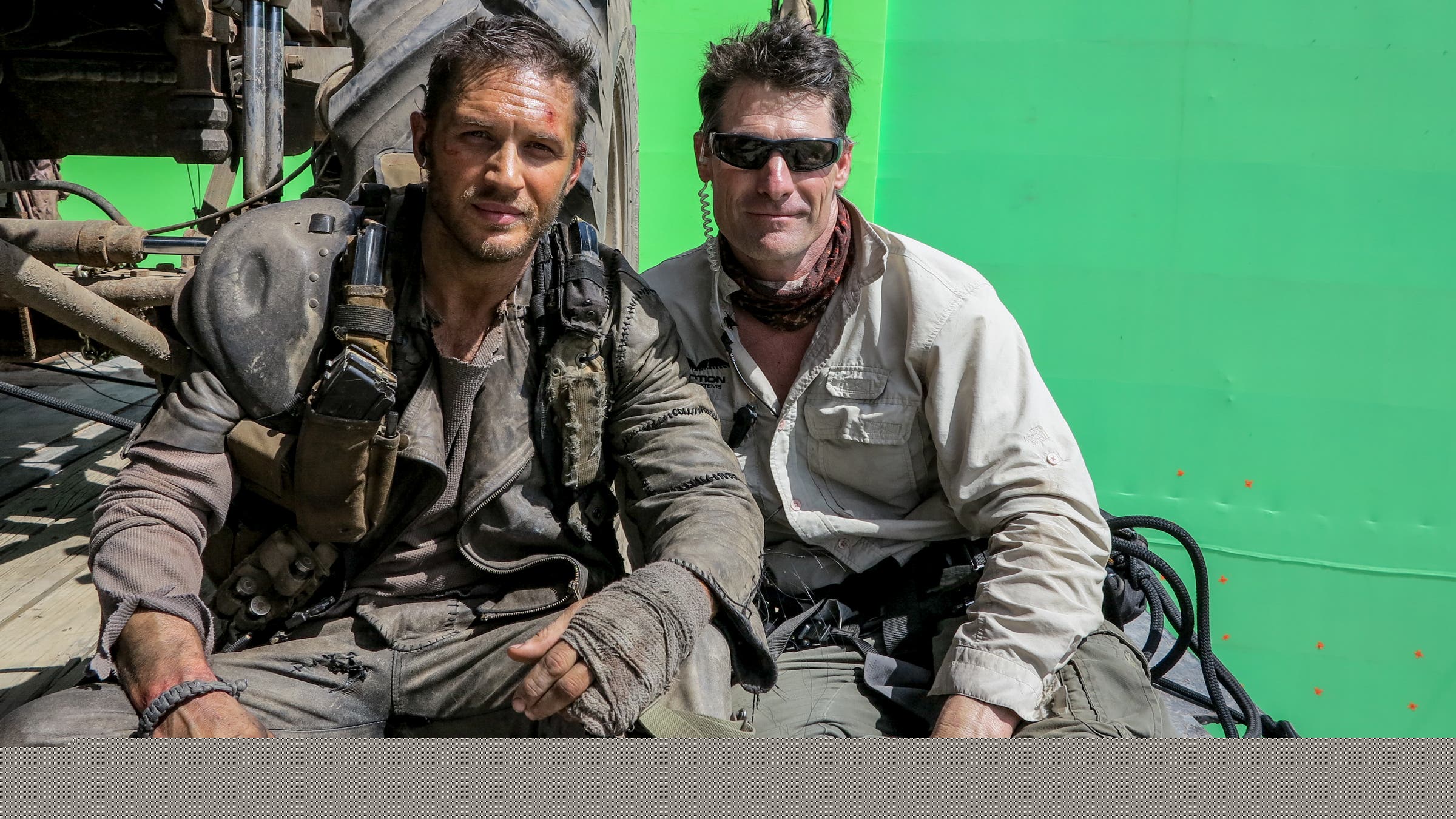Keir Beck and Tom Hardy stand together on a green-screen production set for Mad Max: Fury Road.
