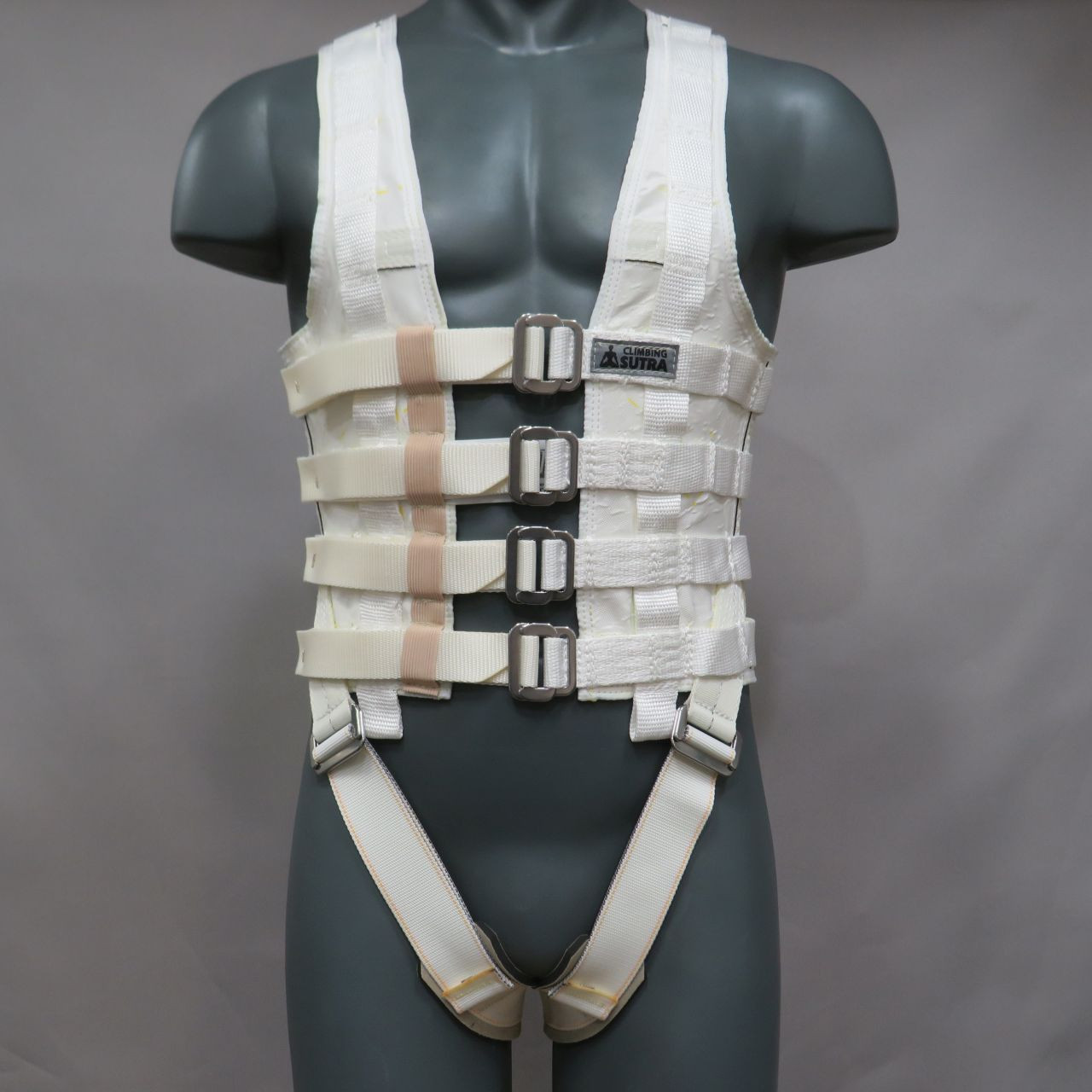 Front view of a black low-profile Climbing Sutra Spectra-Titanium stunt vest with multiple reinforced pick points.