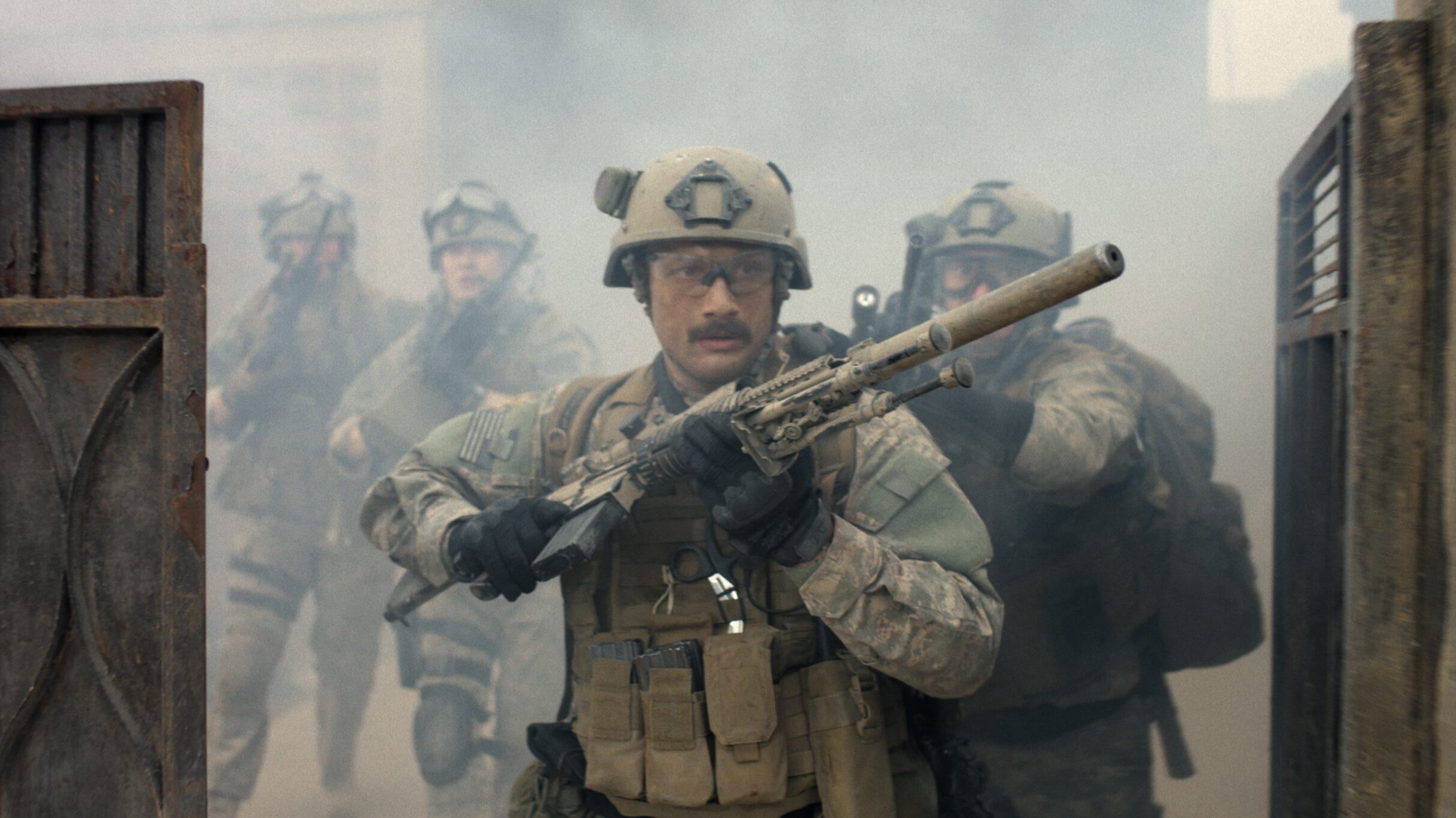 Five soldiers emerge through smoke between two dark barriers in the official textless image for Warfare, with one figure carrying the foreground.